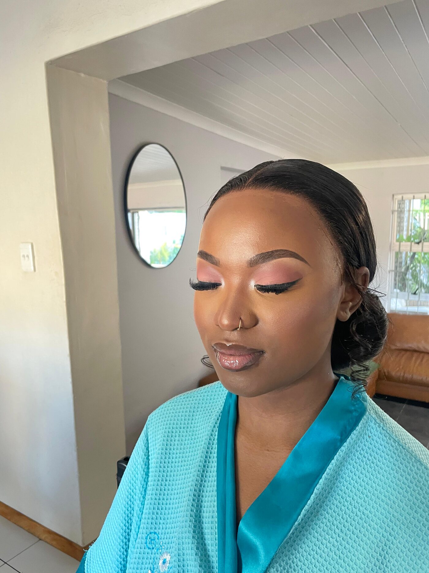 Soft glam portrait in a turquoise robe, side profile, eyes closed