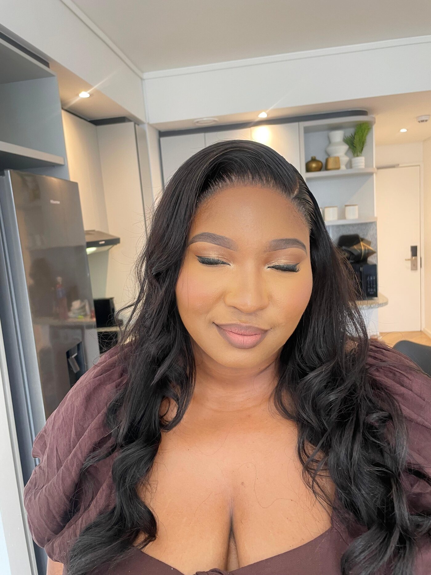 Soft glam portrait with soft waves and warm-toned makeup